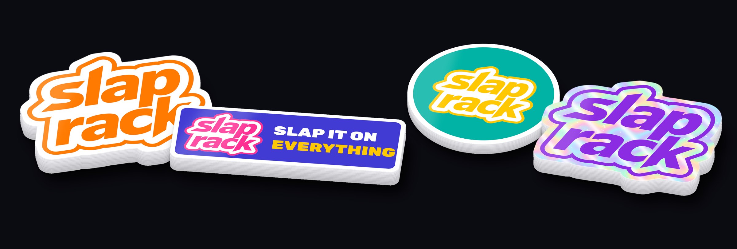 Stacks of SlapRack stickers: die-cut logo, bumper, circle and holographic